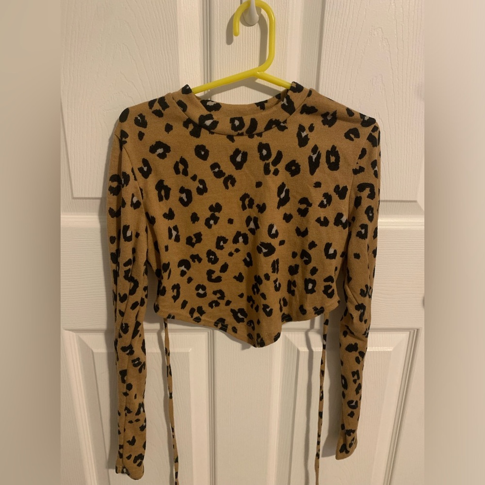 Size medium, cheetah print backless crop top from shop lane.
